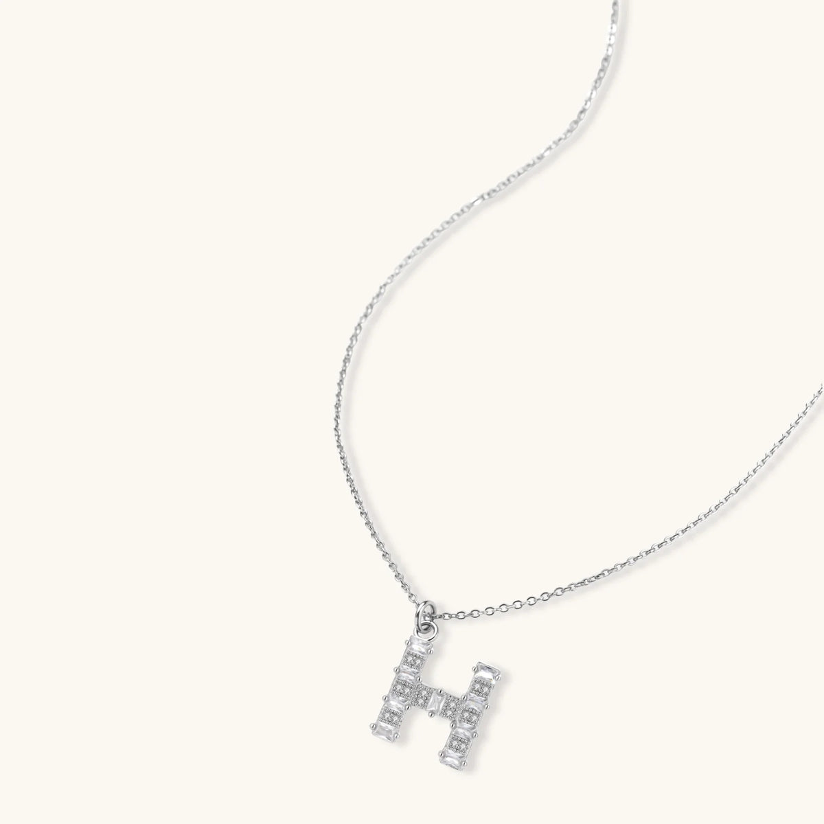 Letter H jewelry set featuring geometric crystal design in gold and white gold plated finish with adjustable chain necklace