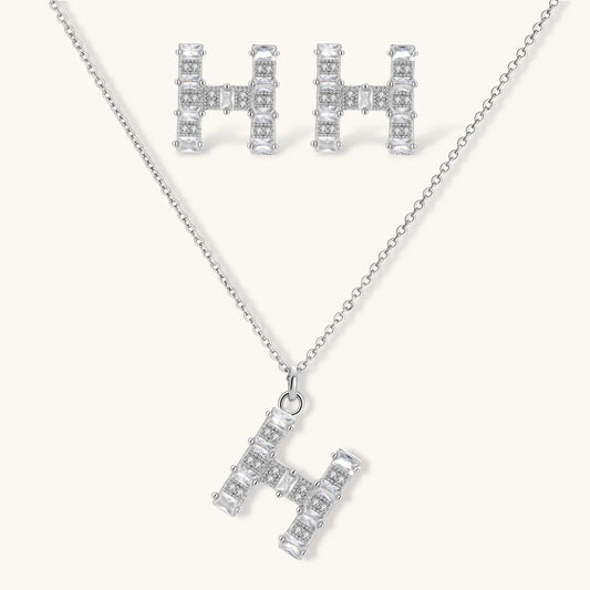 Letter H jewelry set featuring geometric crystal design in gold and white gold plated finish with adjustable chain necklace
