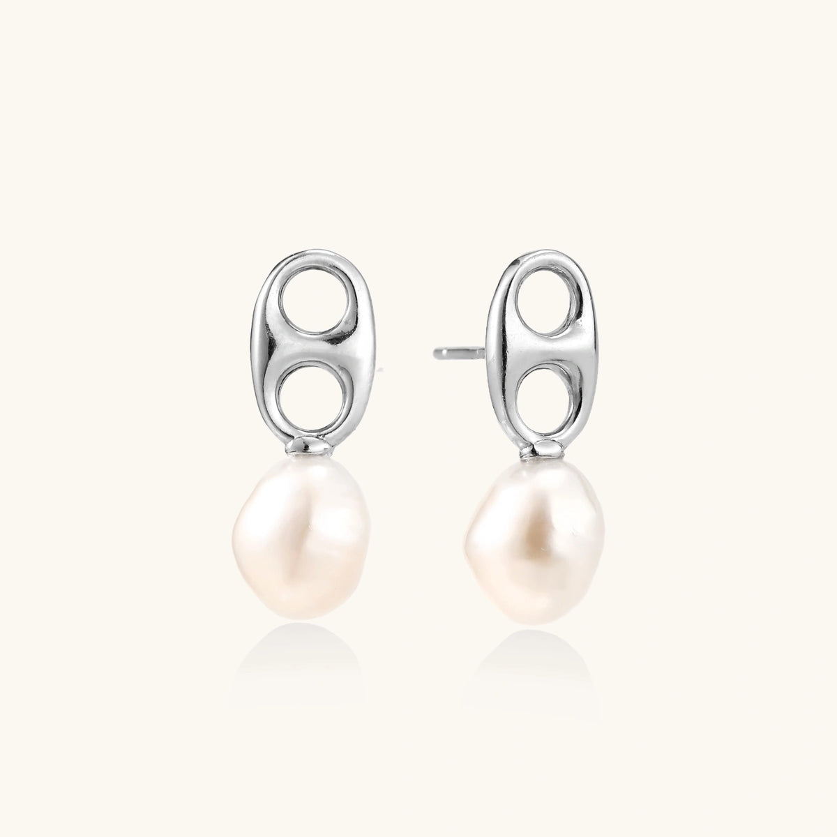 Modern rhodium-plated silver earrings with geometric double-circle design and freshwater pearl drops