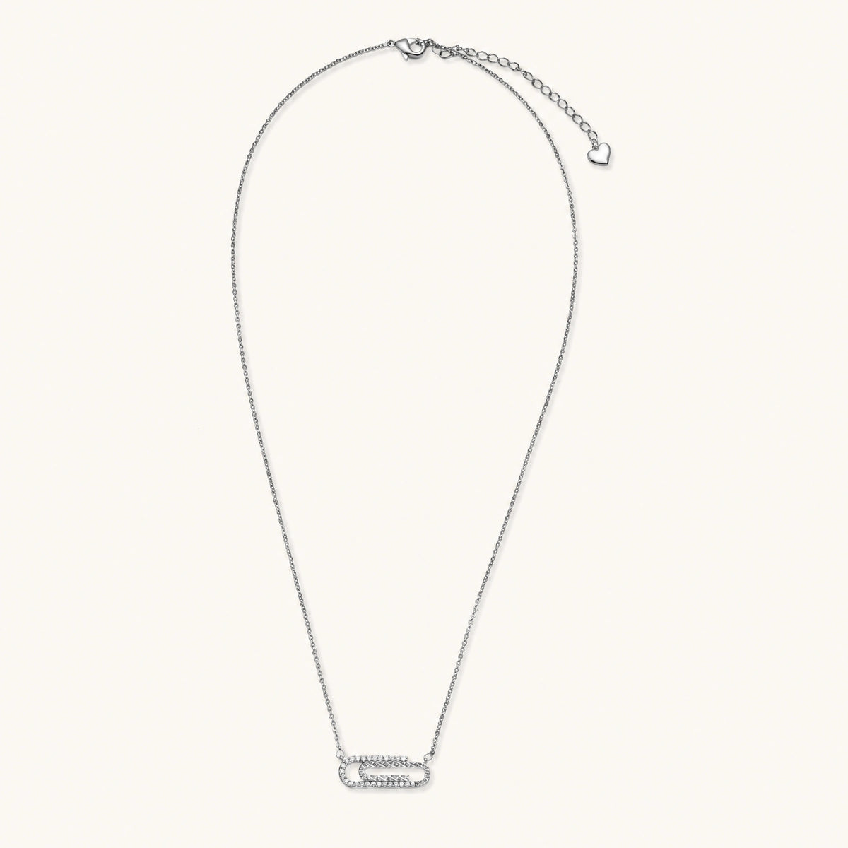 White gold plated necklace with dual-frame geometric pendant featuring crystal pavé border on pale background.
