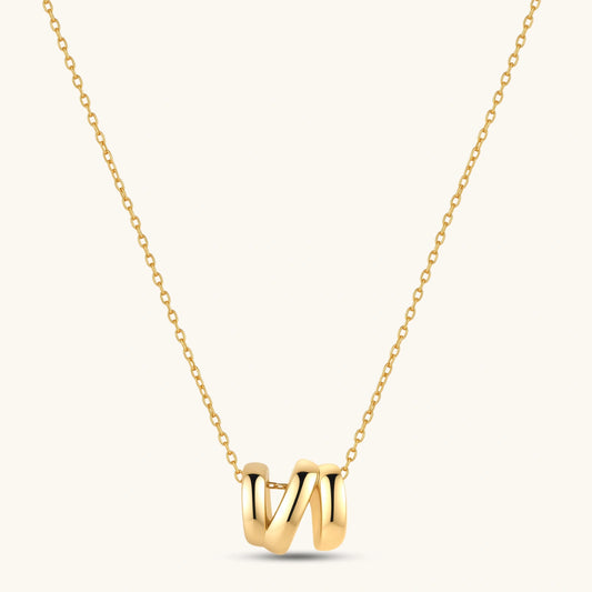 18K gold-plated 925 sterling silver letter N pendant on a delicate adjustable cable chain, cream background.