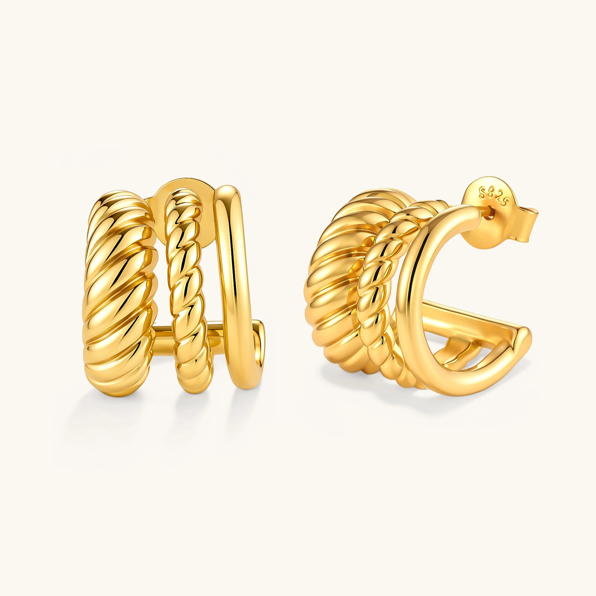 Gold-plated sterling silver triple hoop huggie earrings with rope-twist and smooth band details, shown from front and side.